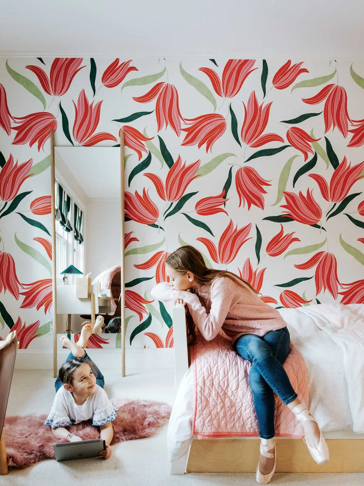 Bold wallpaper sets the tone in Coco (left) and Poppy’s Freeport bedrooms