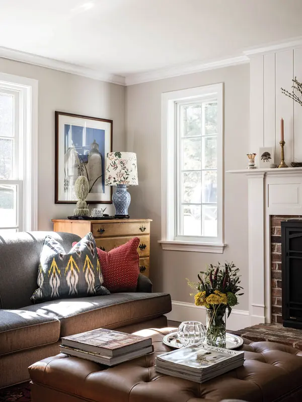 he living room combines an heirloom bureau with local finds, like an Ikat pillow from Home Remedies and brass candlesticks from Blanche + Mimi, both in Portland