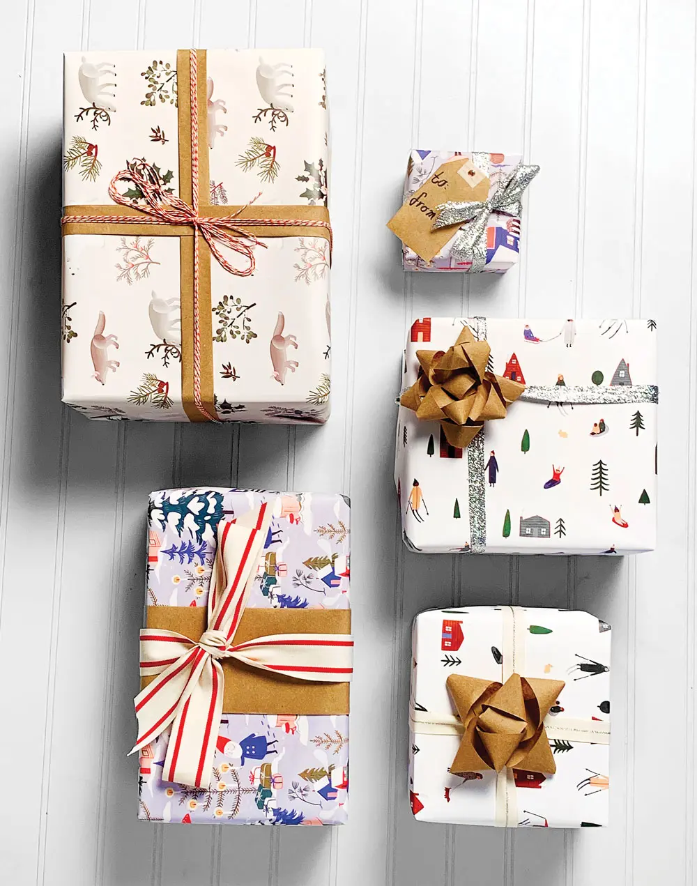 Clap Clap and Red Cap Cards wrapping papers, kraft paper, Divine Twine, and Studio Carta ribbons, available at Gus & Ruby Letterpress.