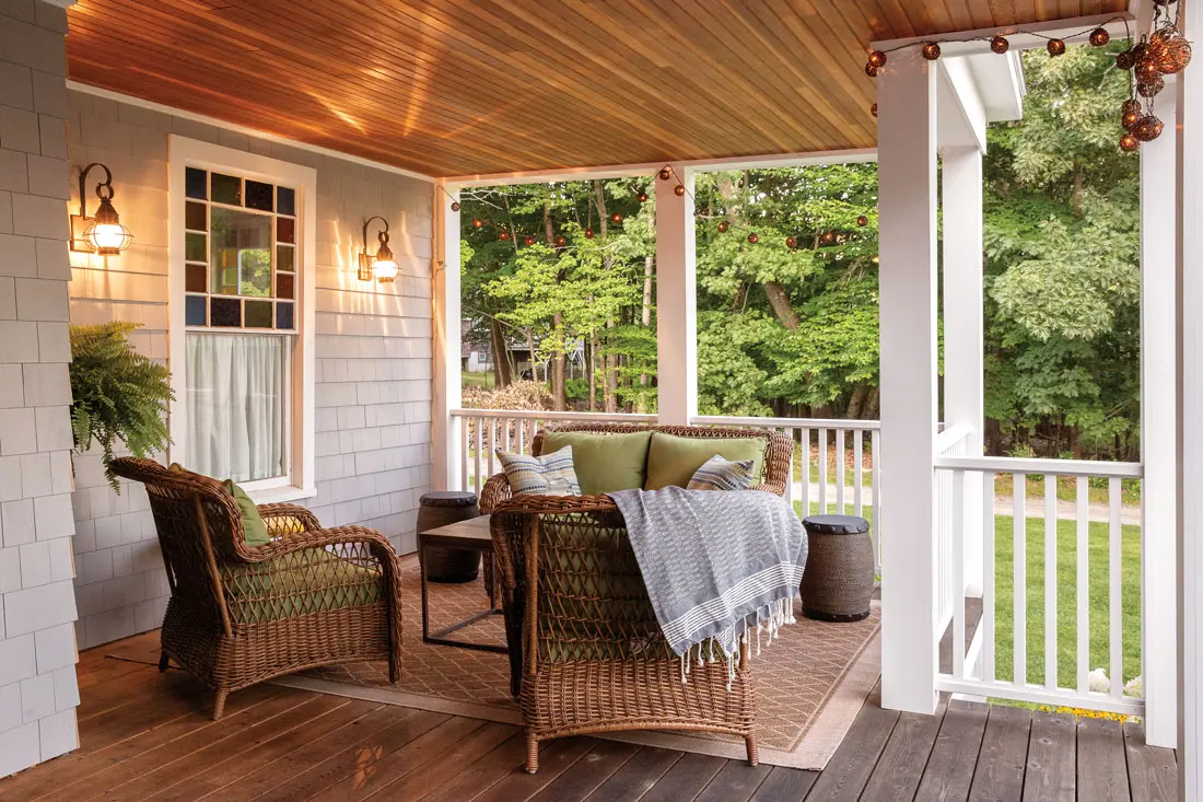 zajk-1 Cushy Lowes wicker seats and a rug from Homegoods create a snug living area on Michele and Mark Zajkowski’s Great Diamond Island porch.