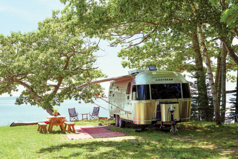 an airstream set up at a Searsport Shores Oceanfront Campground campsite