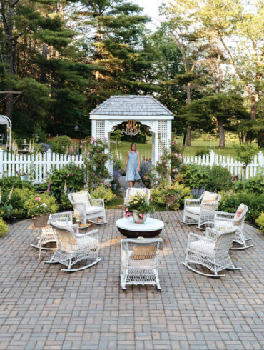 Erin Clark’s patio garden empha- sizes layered mounds of soft colors and John Davis roses, a hardy climbing variety with delicate pink blossoms and a cascading habit.