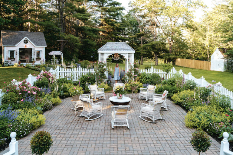 Erin Clark’s patio garden empha- sizes layered mounds of soft colors and John Davis roses, a hardy climbing variety with delicate pink blossoms and a cascading habit.