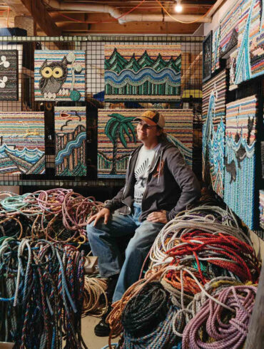 Eric Darling with his rope art and piles of old lobster-trap rope at his Appleton, Maine, studio