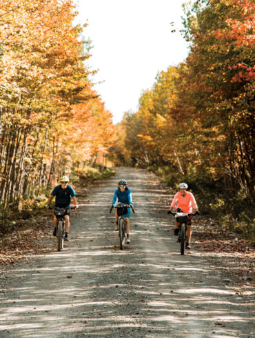 bikers enjoying graveled roads thanks to Appalachian Mountain Club's Maine Woods Initiative