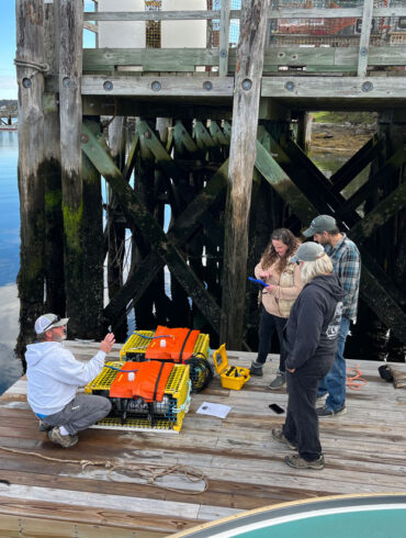 man demonstrating how to use “ropeless” lobster traps