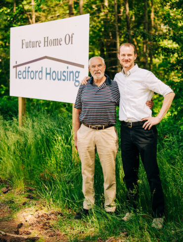 Highland Green resident Frank Strasburger and Tedford Housing executive director Andrew Lardie stand at the building’s future location on just over 3 acres on Thomas Point Rd.