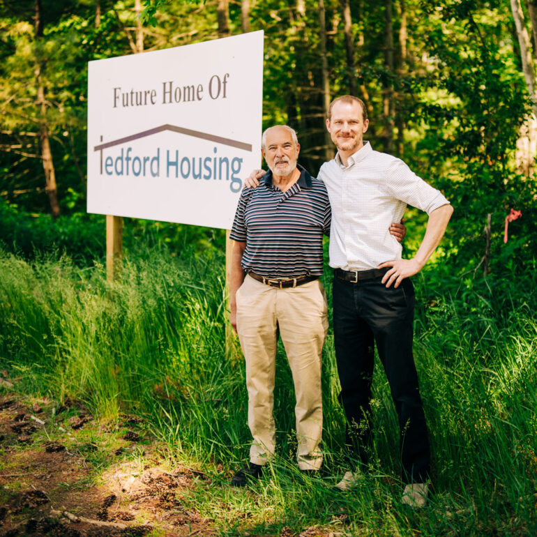 Highland Green resident Frank Strasburger and Tedford Housing executive director Andrew Lardie stand at the building’s future location on just over 3 acres on Thomas Point Rd.