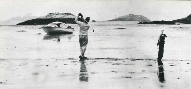 golfers playing in the mudflats of the Tide’s Out Golf Course of Kennebec Point in Georgetown, Maine