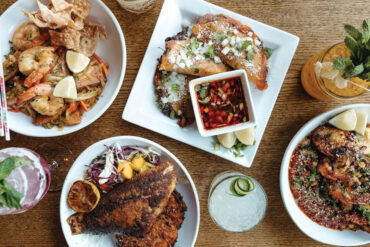 Drunken noodles with shrimp and crispy pork belly; guajillo-braised-brisket tacos; Cajun grilled shrimp with garlic-cheddar grits; Caribbean seared red snapper with sweet-potato latkes from The Butcher The Baker in Bangor, Maine