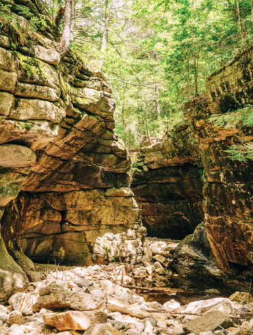 Devils Den, in Roxbury, Maine, covered in green moss