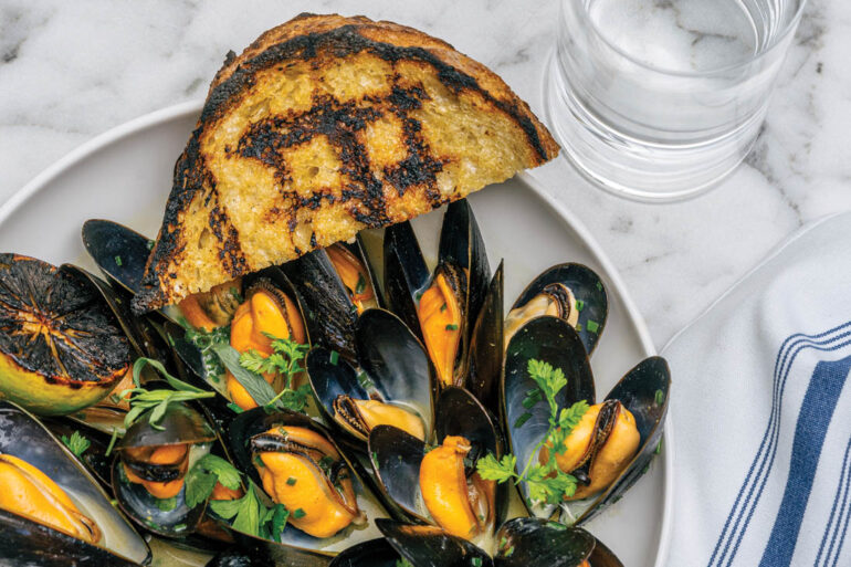 A mussels starter with green curry, coconut, sweet potato, and sourdough from The Good Table, in Cape Elizabeth, Maine