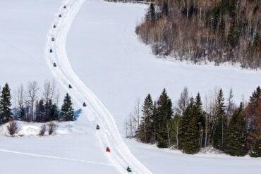 snowmobilers riding on Maine's Interconnected Trail System