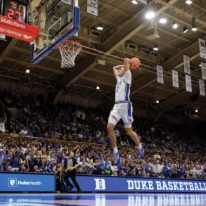 Duke's Cooper Flagg dunks on a fast break during the second half of an NCAA college basketball game against Maine in Durham, N.C.,