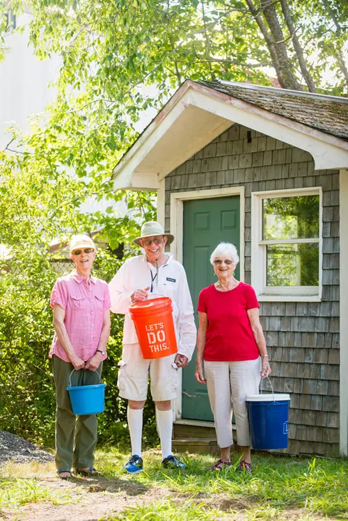 Highland residents outside the compost shed