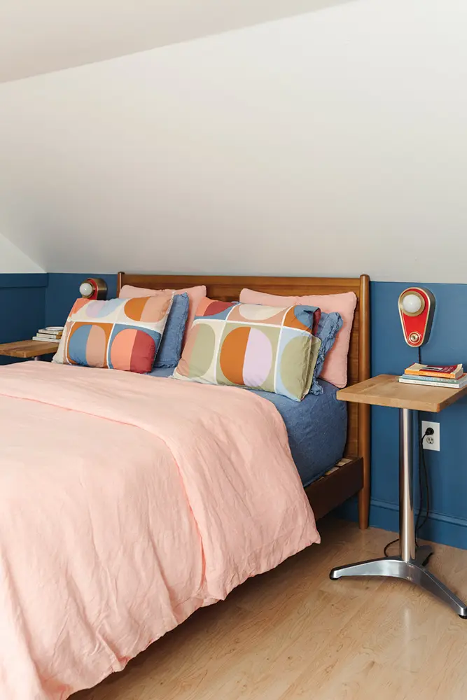 Blue’d Up, by Clare contrasts with peachy Brooklinen bedding in a bedroom