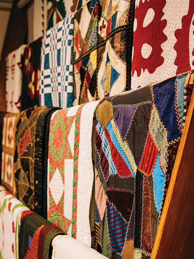 antique quilts hanging in the showroom at Rocky Mountain Quilt in York. 