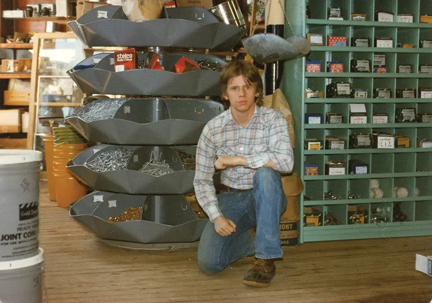 current owner Christopher Wadsworth’s late brother, Kingsley, in front of the nail bin at  S.L. Wadsworth & Son circa 1977