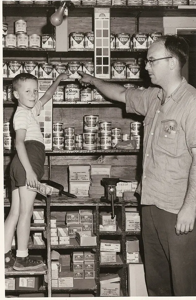 fifth-generation owner Edward G. Wadsworth with the son of a regular customer circa 1955