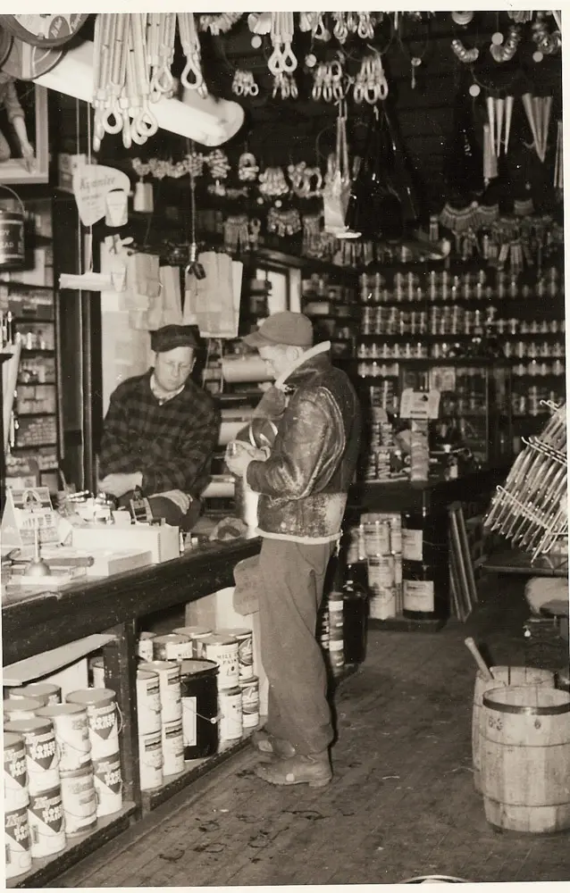 Charlie Stevenson waiting on a customer at S.L. Wadsworth & Son in Eastport  circa 1959