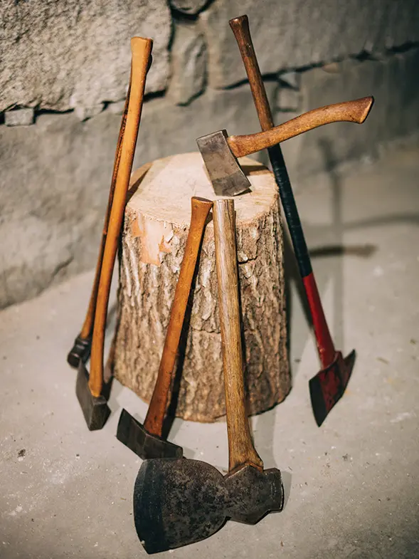 handmade axes around a stump