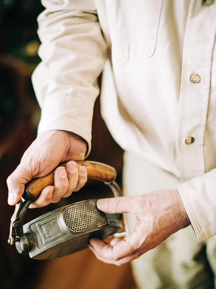 iron collector displaying one of his items