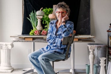 Lynn Karlin posing for a photo in her Belfast Maine studio