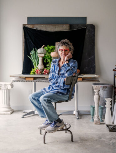 Lynn Karlin posing for a photo in her Belfast Maine studio