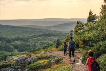 a family hiking Bald Mountain Preserve