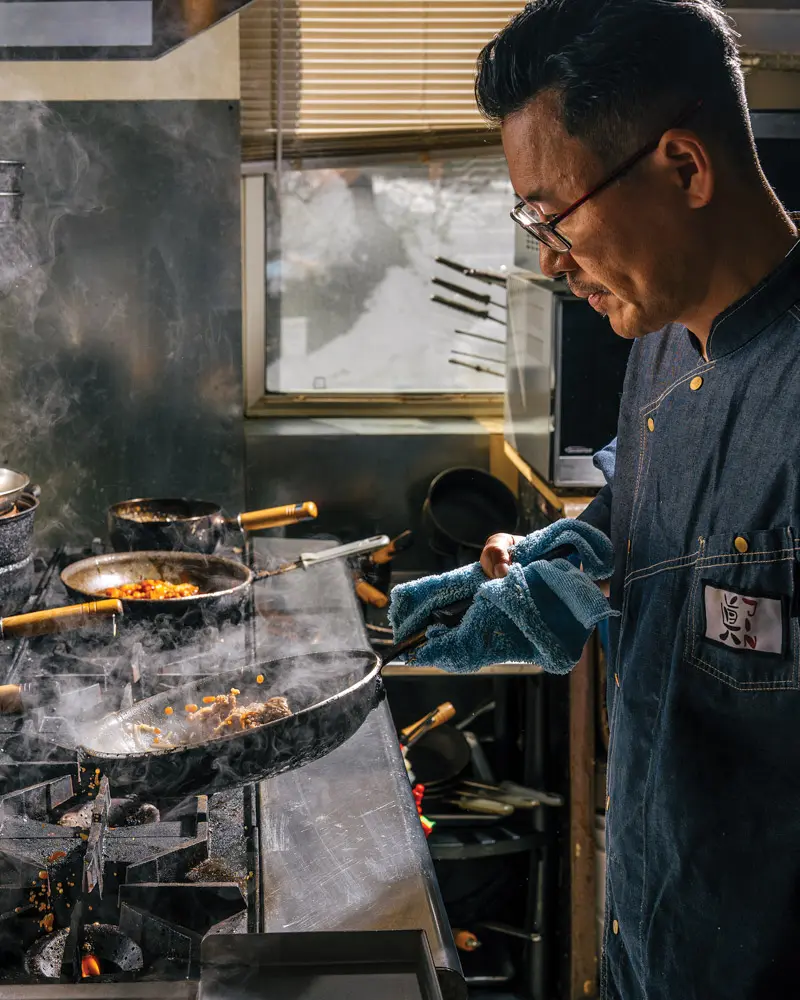 Chef Hwansoo Kim cooking at Jin Sushi and Ramen in Saco, Maine