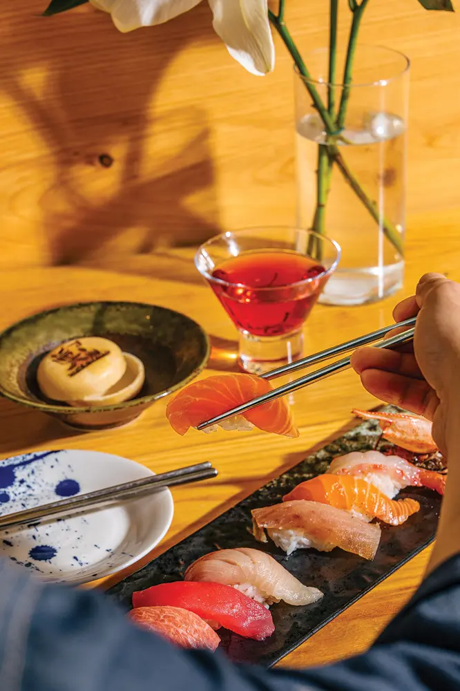 Sushi next to a cocktail