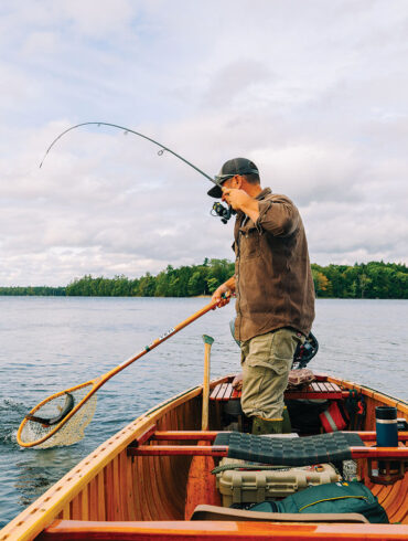 Nate Bacon fishing in his Grand Laker Canoe
