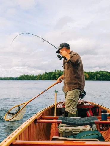 Nate Bacon fishing in his Grand Laker Canoe