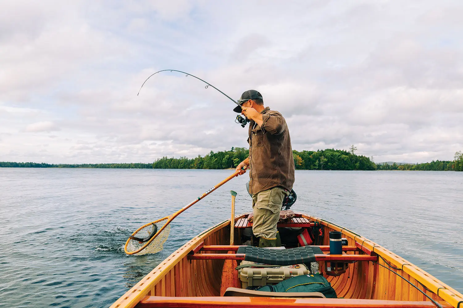 Nate Bacon fishing in his Grand Laker Canoe
