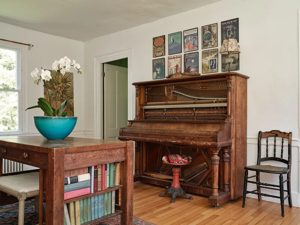 a 1903 Steger & Sons piano in the piano room