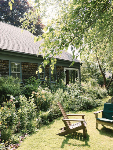 The garden behind Jane Donelon's shingled Cape in Brunswick, Maine