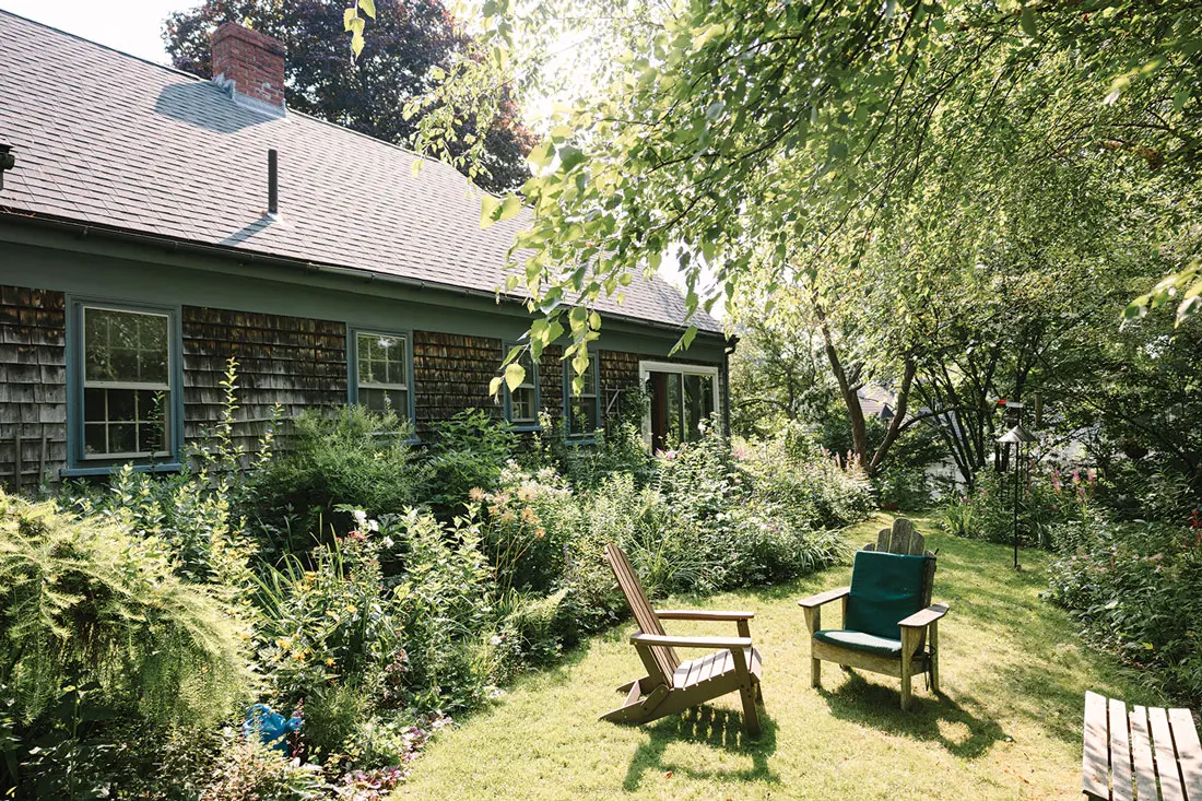The garden behind Jane Donelon's shingled Cape in Brunswick, Maine