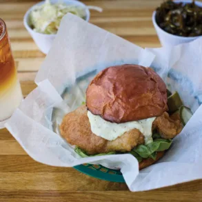The fish sandwich at Biddeford's Fish & Whistle features features a house-made milk-bread bun, a bright tartar sauce, and beautifully breaded Maine fish