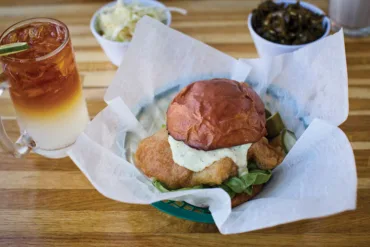 The fish sandwich at Biddeford's Fish & Whistle features features a house-made milk-bread bun, a bright tartar sauce, and beautifully breaded Maine fish