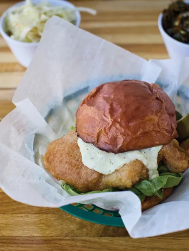 The fish sandwich at Biddeford's Fish & Whistle features features a house-made milk-bread bun, a bright tartar sauce, and beautifully breaded Maine fish