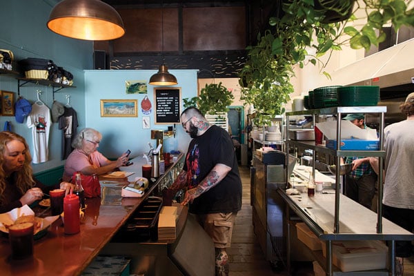 the back-corner bar and open kitchen at Fish & Whistle in Biddeford
