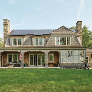 The exterior of Ford and Karen Reiche’s waterfront home, in Freeport, riffs on an 1899 Shingle-style Islesboro cottage designed by famed architect Fred Savage