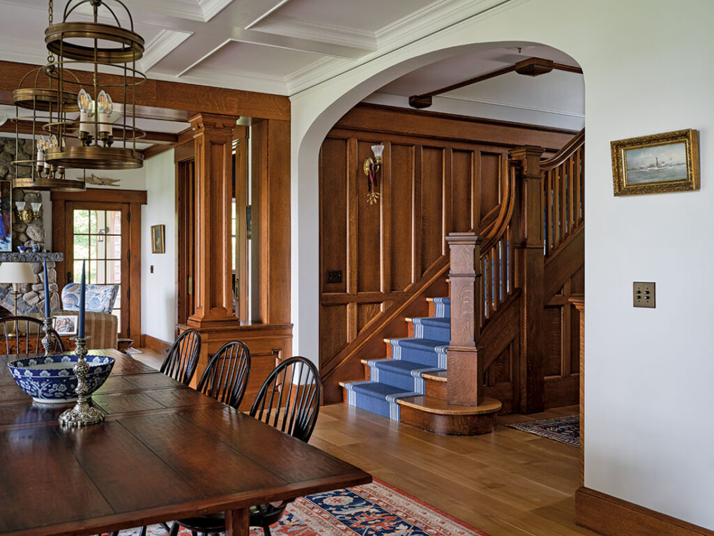 Eighteen oak treads and risers, seven newel posts, and 300 square feet of paneling from Runyan’s grand staircase were reconfigured in the Reiches’ Freeport home