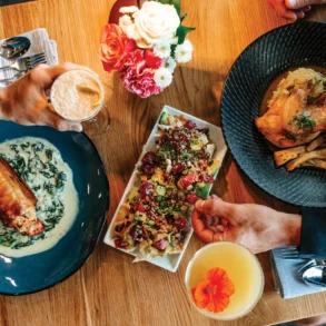 The salmon spanakopita, poke nachos, and roasted half chicken from Yolked Farm to Table in Windham, Maine
