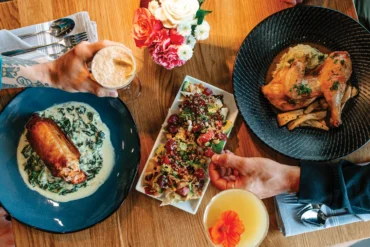 The salmon spanakopita, poke nachos, and roasted half chicken from Yolked Farm to Table in Windham, Maine