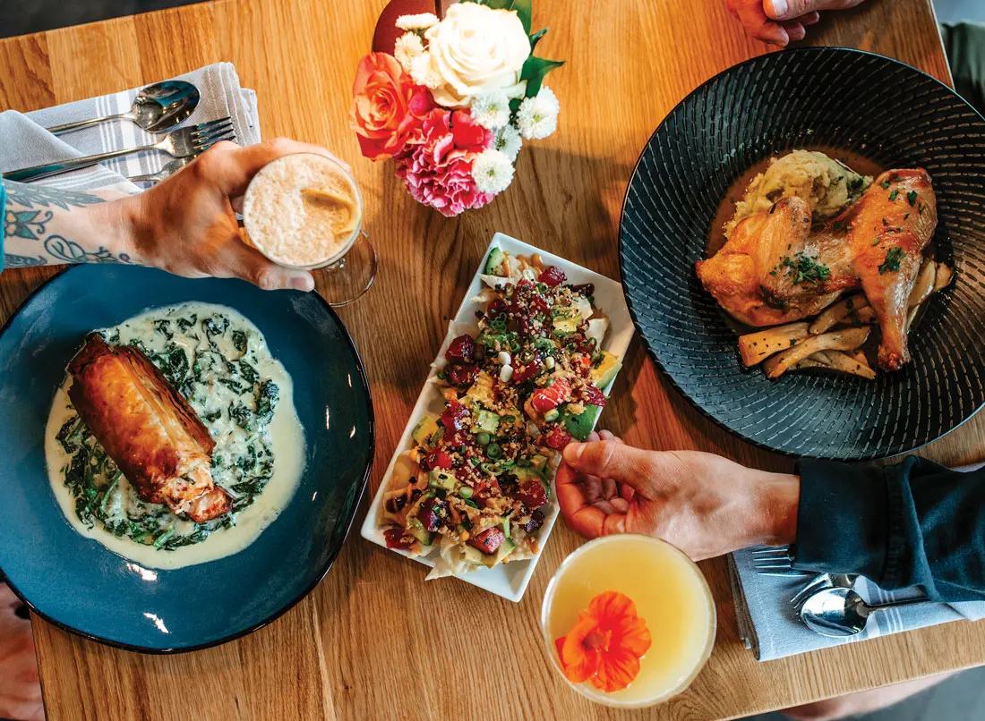 The salmon spanakopita, poke nachos, and roasted half chicken from Yolked Farm to Table in Windham, Maine