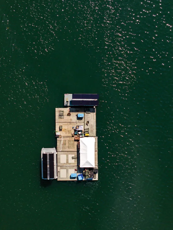 Maine Ocean Farms has solar panels mounted on barges to help power its oyster business.