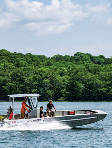 An electric-powered boat from the Boat Yard, in Yarmouth, makes a service call to work on electric-powered machinery at Blackstone Point Oysters, on the Damariscotta River.
