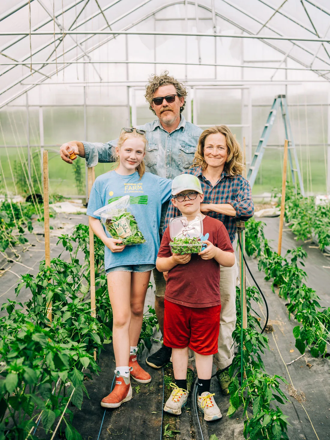 Husband-and-wife team Brendan McQuillen and Brady Hatch grow their MOFGA-certified microgreens in the Morning Dew Seedling + Supply greenhouses located across from their farm.