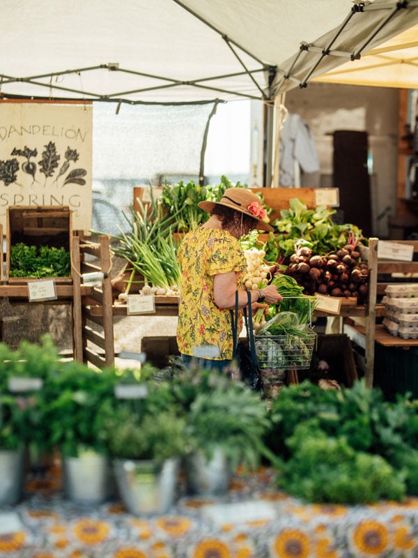 a woman shopping at a Maine farmers market